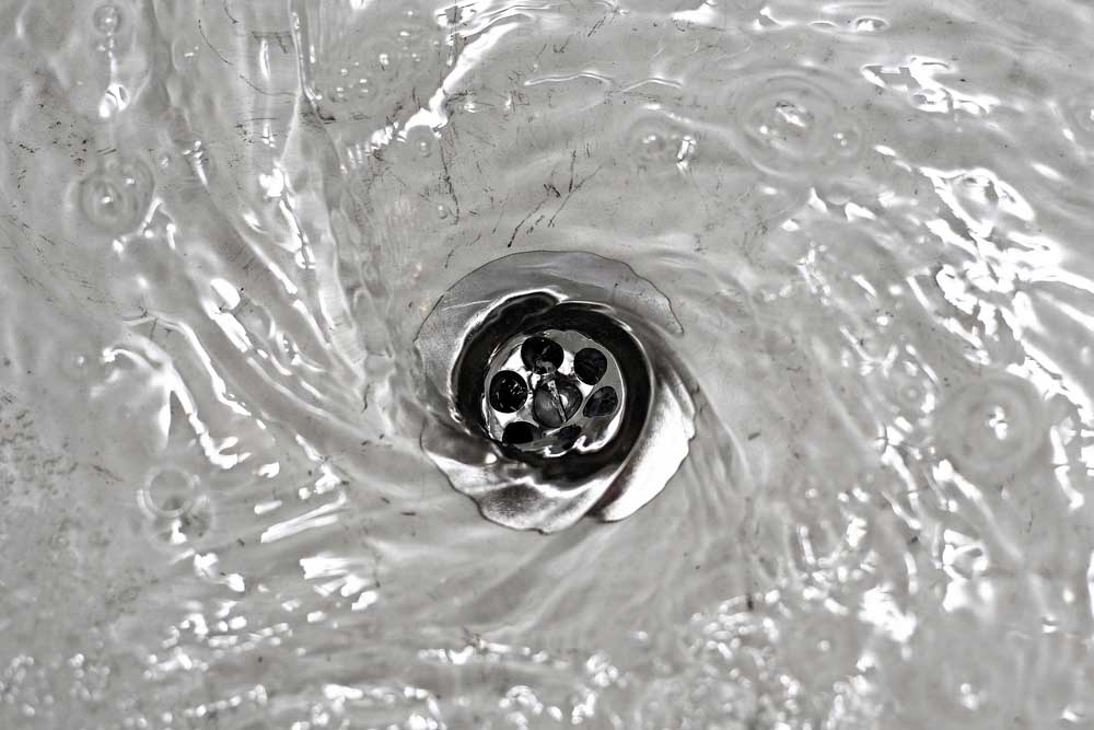 water flowing down the drain