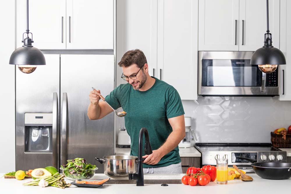 a person preparing food in a home kitchen