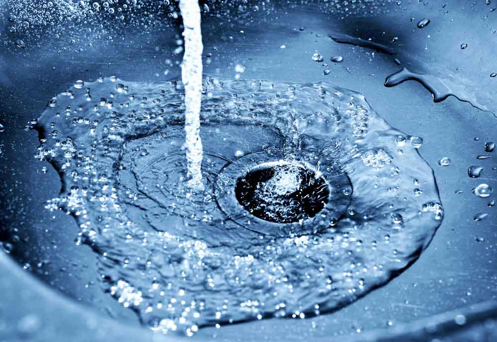 water flowing down the drain