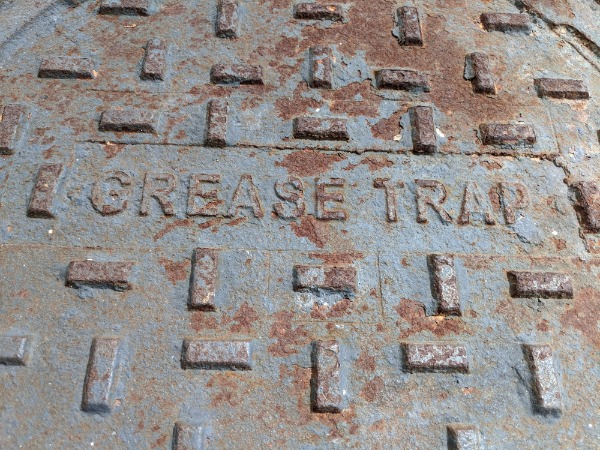 rusty grease trap cover