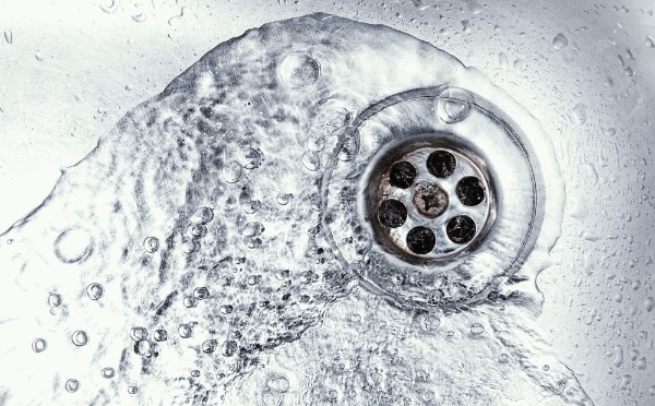 water flowing down sink drain